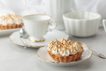 Meringue tart on a white marble countertop.
