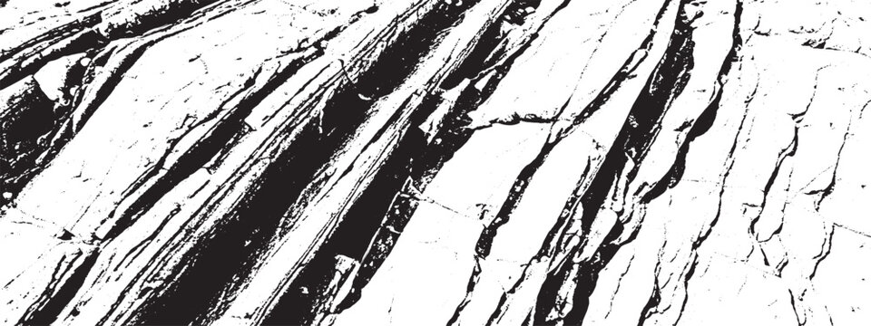 Closeup of rough textured rock surface with deep cracks and striations creating natural black and white pattern