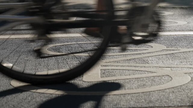 Top View of a Blue shaded bike lane With the Bicycles passing on the white symbol of a bike, Konstanz, Germany.
