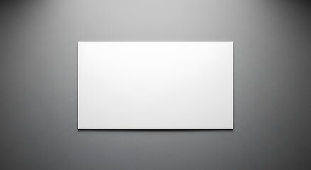 Blank White Canvas on Gray Wall.