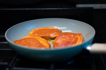 pork fillet cooking in pan