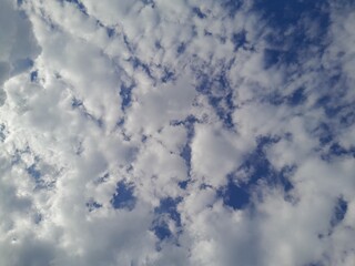 Background with clouds on blue sky. Beautiful sunny sky