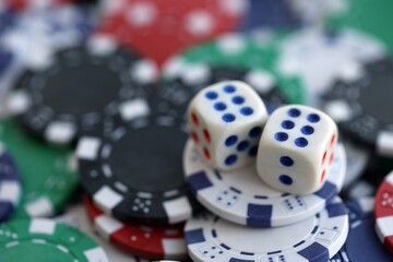 Dice game on the poker table in the casino. A successful combination of dice brought a lot of winning chips