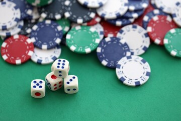 Dice game on the poker table in the casino. A successful combination of dice brought a lot of winning chips