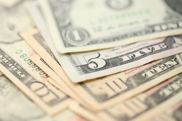 Many dollar bills banknotes in different denominations