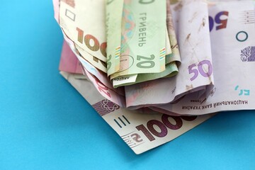 Big amount of different Ukrainian hryvnia money bills. Pile of crumpled ukrainian banknotes