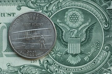 American cent coin on dollar bill close up. United States currency