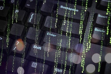 Abstract cyber concept image featuring a keyboard overlaid with green matrix-style code and Japanese characters. Perfect for hacking, cybersecurity, and futuristic digital technology themes.