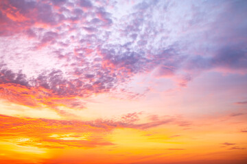 Fototapeta premium Beautiful , luxury soft gradient orange gold clouds and sunlight on the blue sky perfect for the background, take in evening,Twilight, Large size, high definition landscape photo