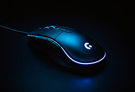 Photo Illuminated Gaming Mouse on Dark Background