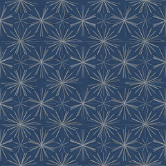 Intricate geometric starburst pattern in deep navy blue and subtle beige repeating seamlessly across the surface