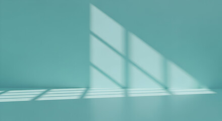 Sunlight streams through a window casting beautiful shadows on a serene light teal wall and floor, perfect for your next product photoshoot or design project.