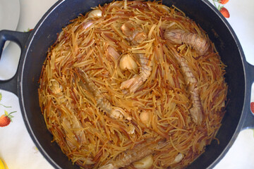 noodle fish dish as spanish food