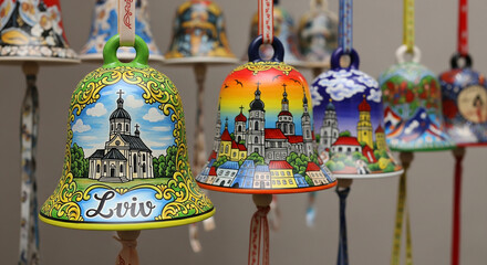 Handpainted ceramic bells featuring landmarks of lviv, ukraine, showcasing intricate details and vibrant colors, perfect for souvenir collections and cultural displays