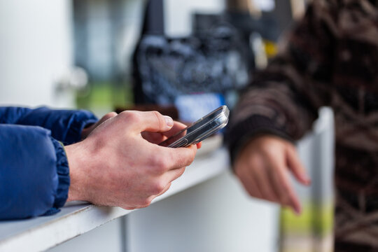 coffee van barista with mobile phone doing social media reels post