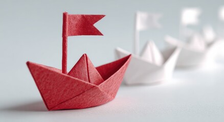 Red origami boat leading a row of white boats (2)