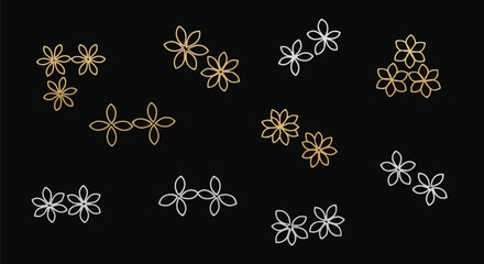 Arrangement of delicate floral outlines in gold and silver against a black background.