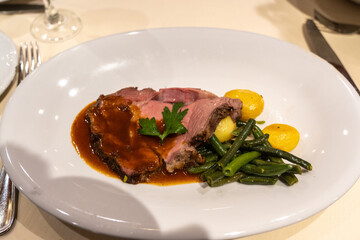 Beef with green asparagus beans and potatoes