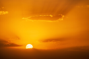 A Fiery Sunrise with Sunbeams