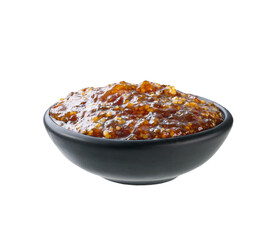 figs jam in a black bowl isolated on white background.