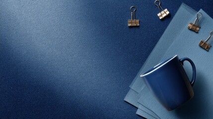 A minimalist top-down composition with muted blue shades,