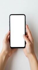 Smartphone displaying blank screen held by hands in studio setting