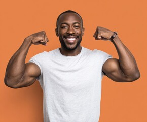 A confident man displays his toned physique against a vibrant orange backdrop.