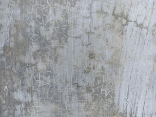 Cracked Concrete Wall Texture. Close-up of cracked concrete wall surface with subtle lines and rough patterns, ideal for abstract backgrounds and grunge designs
