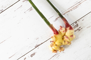 Fresh ginger from the farmers market with stem intact.