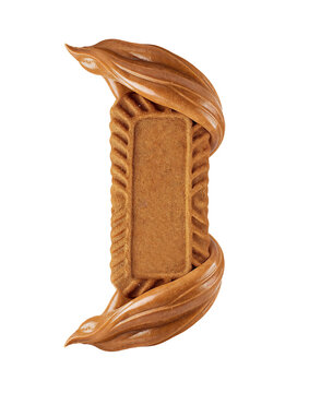 A close-up studio shot shows a single, rectangular, brown Lotus Biscoff cookie standing vertically, enveloped by a swirl of smooth, glossy, brown cookie butter on a white background.