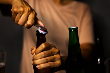 Woman Opening Beer Bottle With Opener