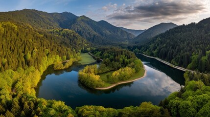 Fototapeta premium A serene landscape with a mirror-like lake surrounded by lush forests,