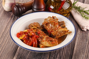 Baked lamb ribs with vegetables