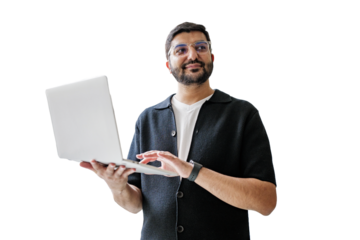 Man happily using a laptop in a relaxed way.