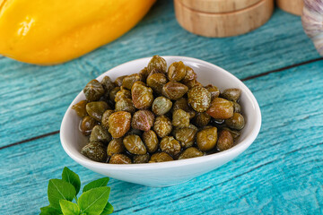 Pickled canned capers in the bowl