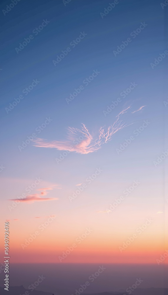 Poster serene sky at dawn with whispering clouds illuminated by soft pink and orange hues creating a tranqu