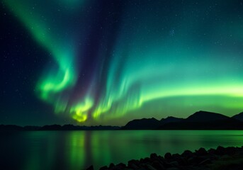 Naklejka premium Vibrant green borealis illuminates a tranquil mountain landscape.