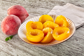 Sweet ripe yellow canned peaches