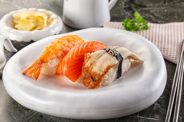 Japanese cuisine - sushi with eel, salmon and prawn