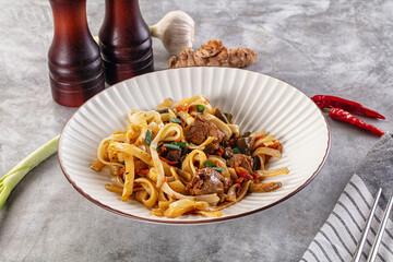 Asian cuisine udon with chicken and vegetables