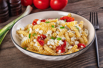 Italian pasta fusili with curd