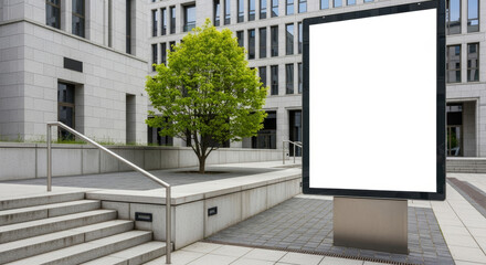 Obraz premium A blank billboard stands near steps and a tree outside a modern building on a cloudy day outdoors