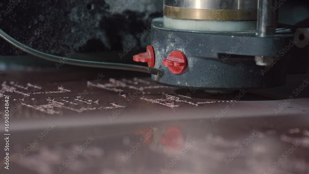 Aufkleber precision industrial milling machine performing automated engraving on metal plate, generating intri