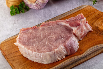 Raw pork steak with bone