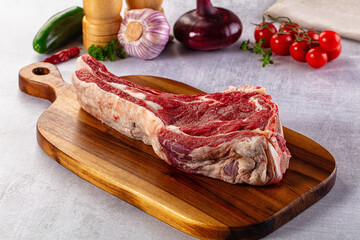 Raw prime beef steak with bone