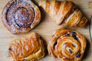 Selection Of Baked Danish Breakfast Pastries Croissant, Cinnamon Swirl, Pain Au Raisin, Choc Au Pain