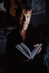 Beautiful and stylish elderly woman posing for the camera expressing emotions.