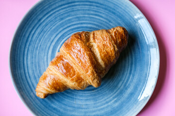 Single Butter Croisant Served On A Plate