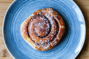 Single Cinnamon Swirl Breakfast Pastry Served On A Plate