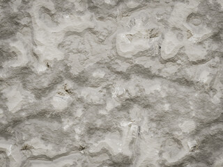 Abstract grayish cement rock texture with uneven surface details.